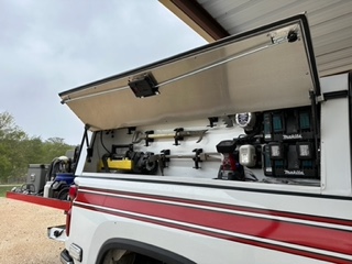 Equipment panel at the side of a command vehicle